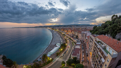 Fototapeta premium Panorama over Nice city and Mediterranean Sea aerial day to night timelapse
