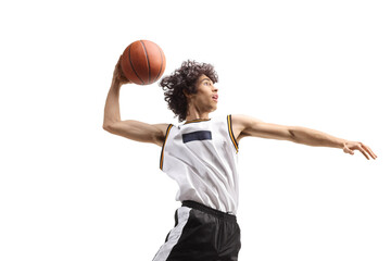 Basketball player up and a slam dunk pose