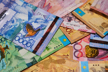 Large tenge banknotes of different denominations close-up