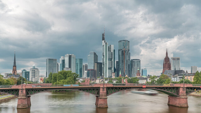 Aerial hyperlapse of Frankfurt skyline with Main River and Ignatz Bubis Bridge. Frankfurt, Germany