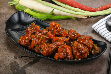 Manchurian chicken with sauce and spices