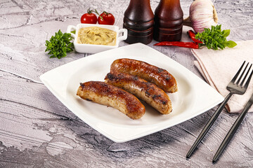 Delicous natural roasted sausages in the plate
