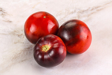 Black ripe juicy organic tomato