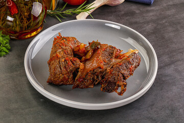 Baked beef ribs with vegetables