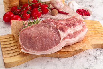 Raw potk loin steak with bone