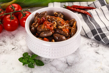 Baked chicken hearts with vegetables