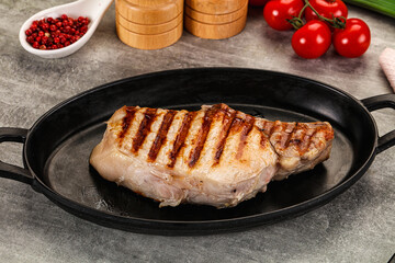 Grilled pork loin steak with bone