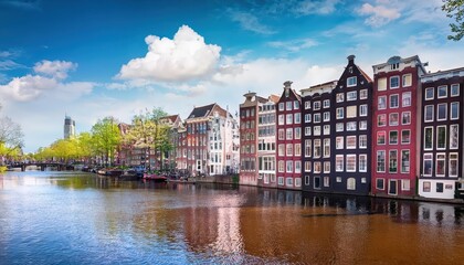 Springtime in Old Amsterdam Vibrant Dancing Houses Over the Amstel River, Capturing the Charm and Elegance of a European Cityscape.