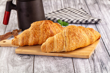 Fresh hot homemade croissant for breakfast