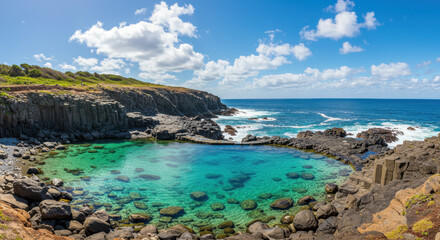 Fototapeta premium Serene Coastline: Discover the Turquoise Paradise of Basalt Pools & Rocky Shores under a Sunny Sky | Australia's Coastal Beauty