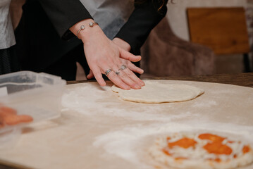 The pizza making process.Cooking homemade pizza