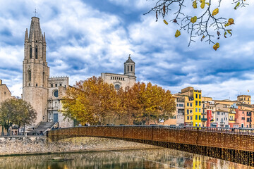 Pont de Sant Feliu bridge decorated with Christmas lights over Onyar River in Girona. View of Sant...