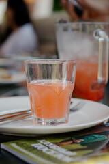 Cherry juice in a jug. Full jug of sour cherry juice