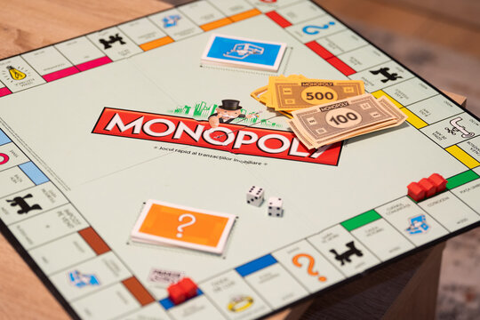 Bucharest Romania 11 March 2025. Monopoly game board. Selective focus on the houses and hotels. 