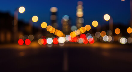 ** City Lights Bokeh: A Nighttime Blur of Traffic, Towers, & Streetlights