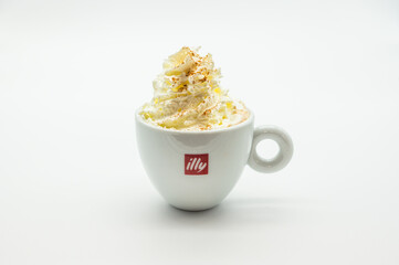 A white cup with a red logo that says 