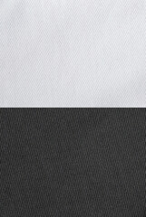 Reverse side of the fabric. High-quality clothes. Texture, background is white and black.