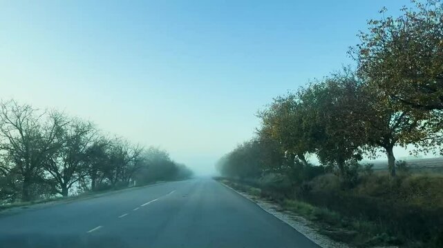 Empty highway road with fog and blue sky