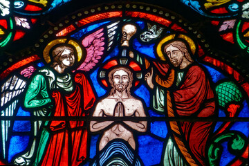 Stained glass (19th century) of Baptism of Jesus by John the Baptist in the Jordan river.