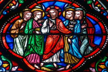 Fototapeta premium Stained glass (19th century) of Jesus walking with his apostles.