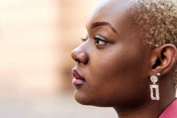 Young black woman showing confidence and determination while looking away
