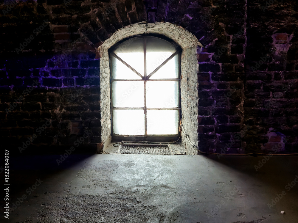 Poster old stone wall with a vintage window casting a soft light. the contrast between dark textures and il