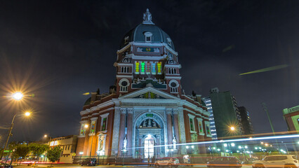 Obraz premium Exterior of the Immaculate Heart of Mary Church illuminated at night timelapse hyperlapse. Lima, Peru