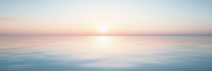 Fototapeta premium Serene sunset over calm waters with a beautiful gradient from lavender to pale blue in a peaceful horizon