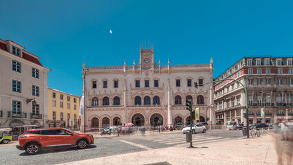 Rossio station in Lisbon timelapse hyperlapse. Front view with zebra crossing and street traffic.