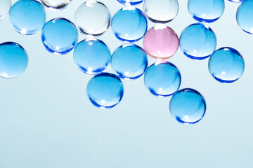 Collagen molecules on blue background. Hyaluronic acid skin care, collagen serum drop background....