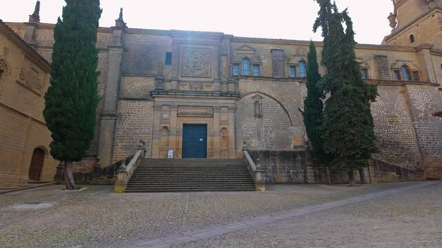 Facade of the medieval cathedral of Baeza with its tall bell tower, Andalusia.