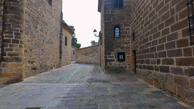 Narrow alleys with stone houses next to the medieval cathedral of Baeza, a world heritage site, Andalusia.
