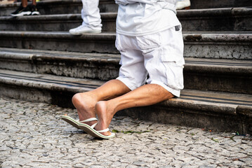 A Catholic is seen kneeling during mass on the last Friday of 2024 at the Bonfim Church. Salvador,...