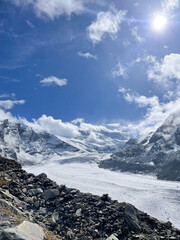 mountain landscape with clouds and snow. We can see a glacier in the background. Swiss Alps