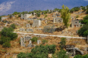 Fototapeta premium High view of the village of Raftis, abandoned since the 1960s, built by the Venetians around 1400, later served as an observatory for the Turks due to its location - Beautiful natural landscape
