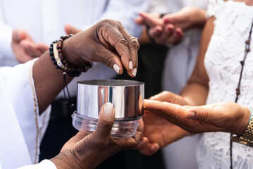 Catholics receive the host during mass on the last Friday of 2024.