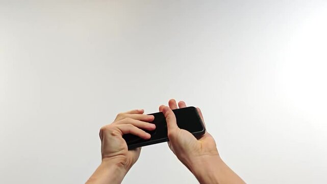 Hands Catching Falling Smartphone Mid-Air