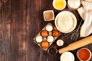 Kitchen background of food preparation with space for text. Culinary ingredients for making pie and...