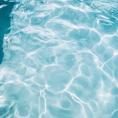 Obraz premium Crystal clear turquoise water surface with sunlit ripples