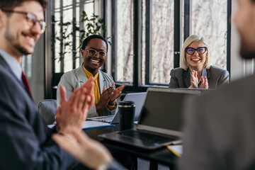 Confident business team brainstorming ideas during a corporate meeting