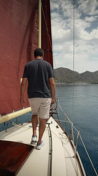 Close up vertical angle footage of a sailboat moving in the sea. Aegean Sea, Turkey