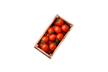 Ripe red cherry tomatoes in a wooden box