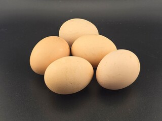 Eggs on black background