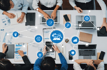 A dynamic business team collaborates in a modern office setting, utilizing technology and data...
