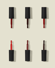 brush with red nail polish and glitter on white background