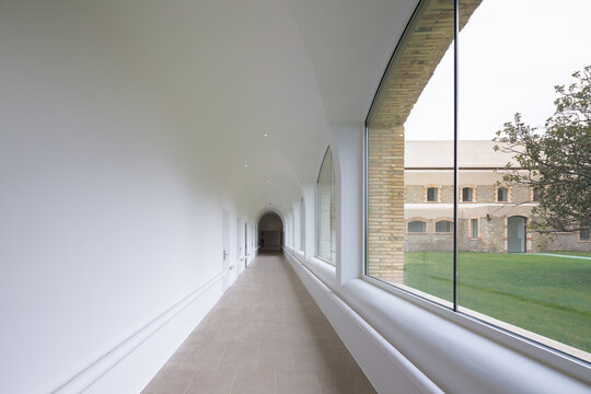 Modern architectural corridor of hospital with arched windows - Powered by Adobe