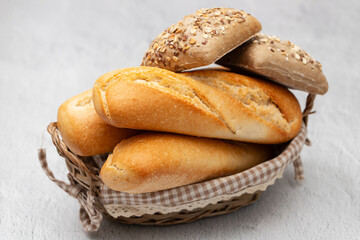 Different freshly baked bread loafs in basket