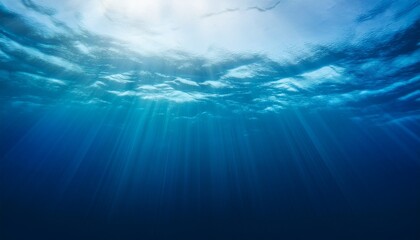  Dark blue ocean surface seen from underwater. Illustration of sun light rays under water