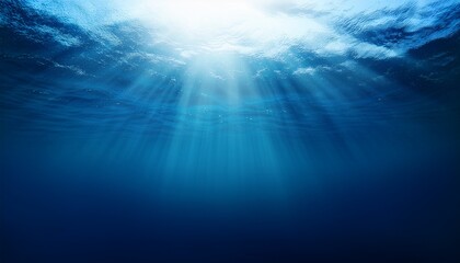 Fototapeta premium Dark blue ocean surface seen from underwater. Illustration of sun light rays under water