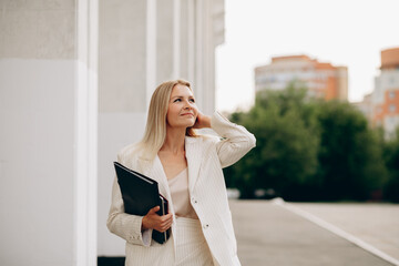 Businesswoman with confidence strolling in urban setting